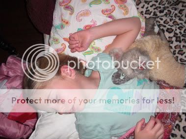 Jade and Priscilla asleep! Jade asleep with Priscilla when she was two days old!